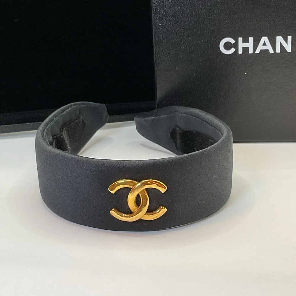 CHANEL Black Headband with Gold Logo Accent